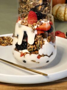 Seeded brittle and berry yogurt parfait layered with fresh berries and crunchy homemade seeded brittle